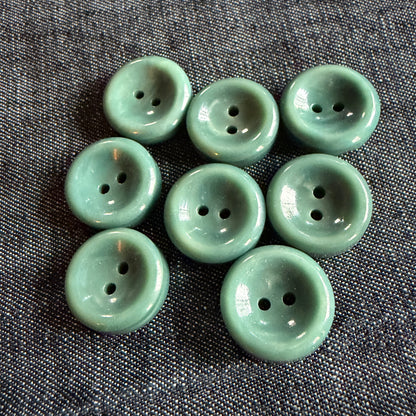 Natural teal casein concave button, handmade in Argentina.