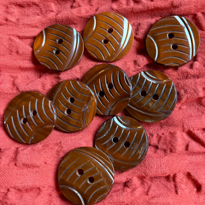 Detail of a carved brown casein shank button, 34 mm.