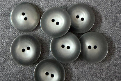 Set of grey buttons on a textured gray surface