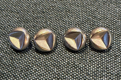 Set of decorative buttons on a textured surface