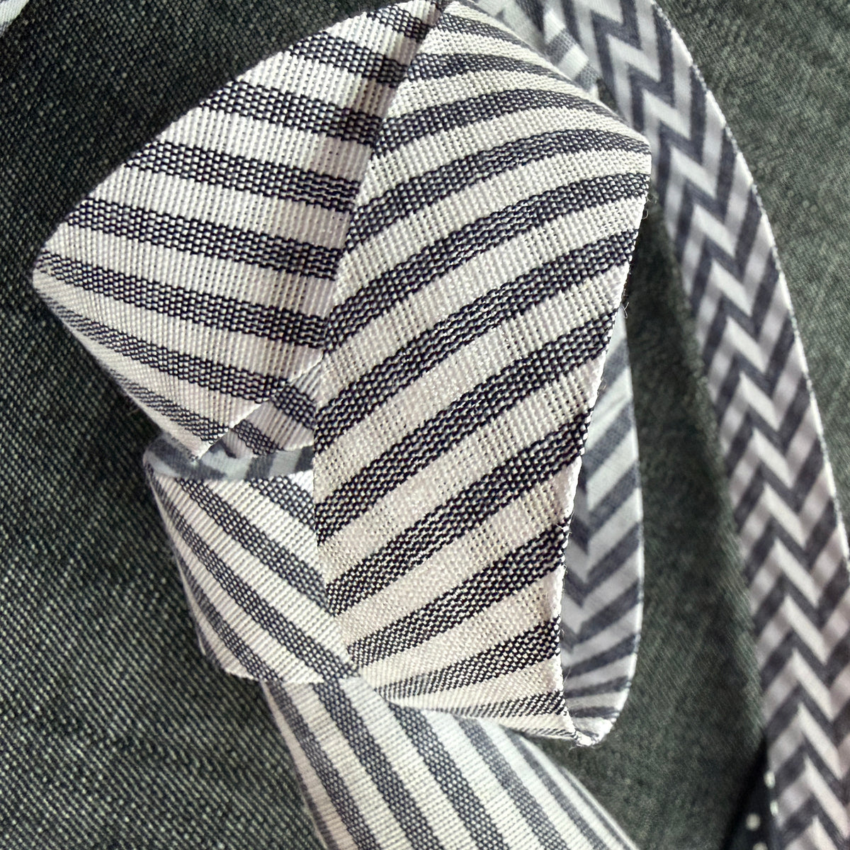 Grey and white striped cotton bias tape on the roll