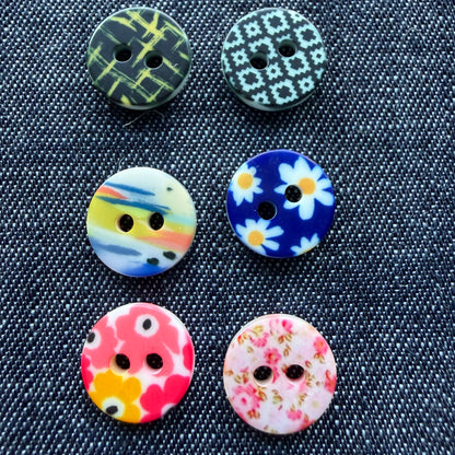 Whimsical patterned plastic shirt buttons in six prints on denim
