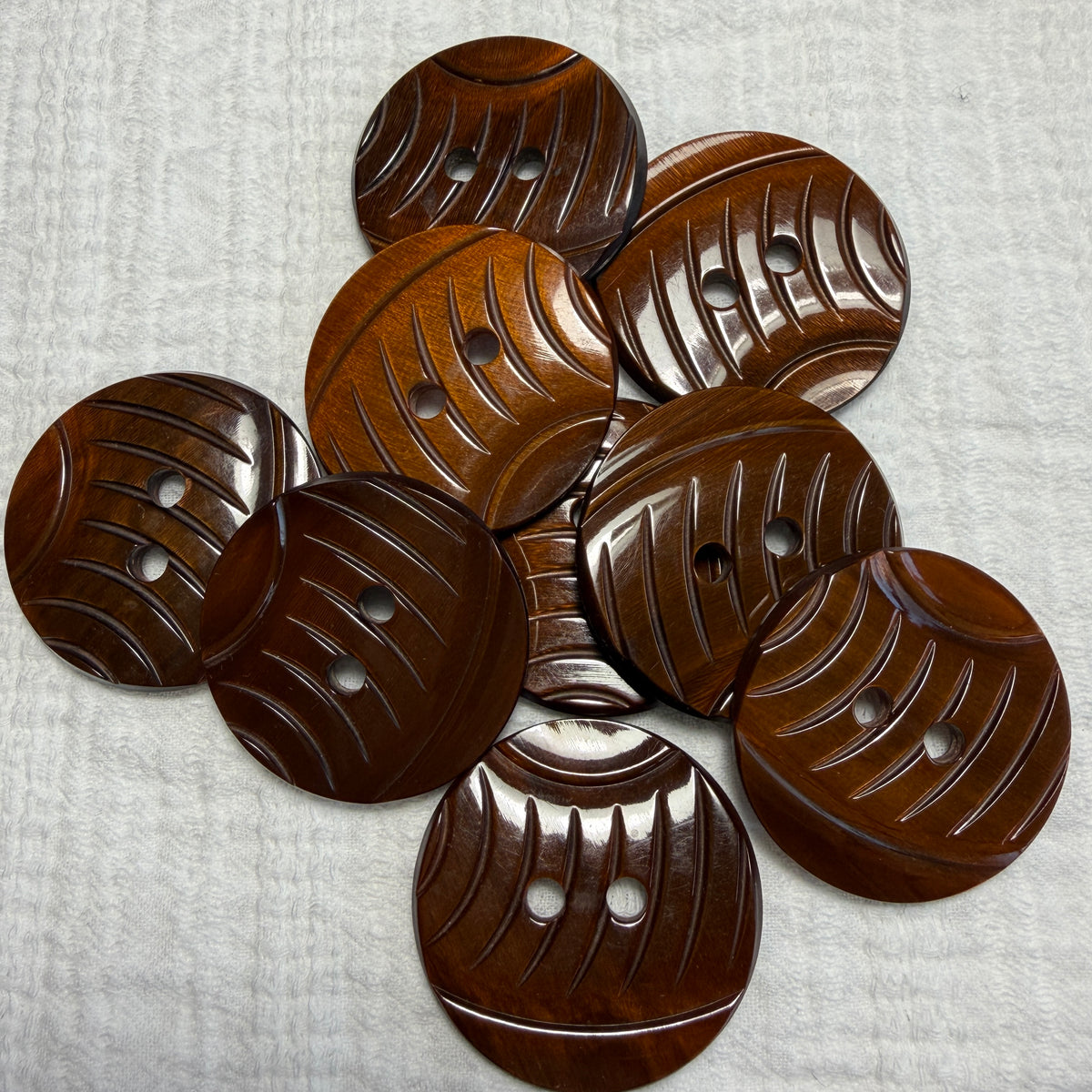 Natural brown carved casein jacket buttons, set of 3.