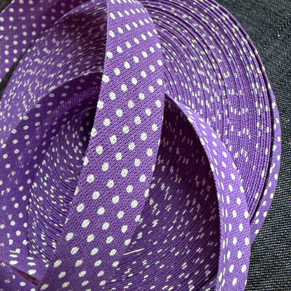 Purple polka dot cotton bias tape on the roll