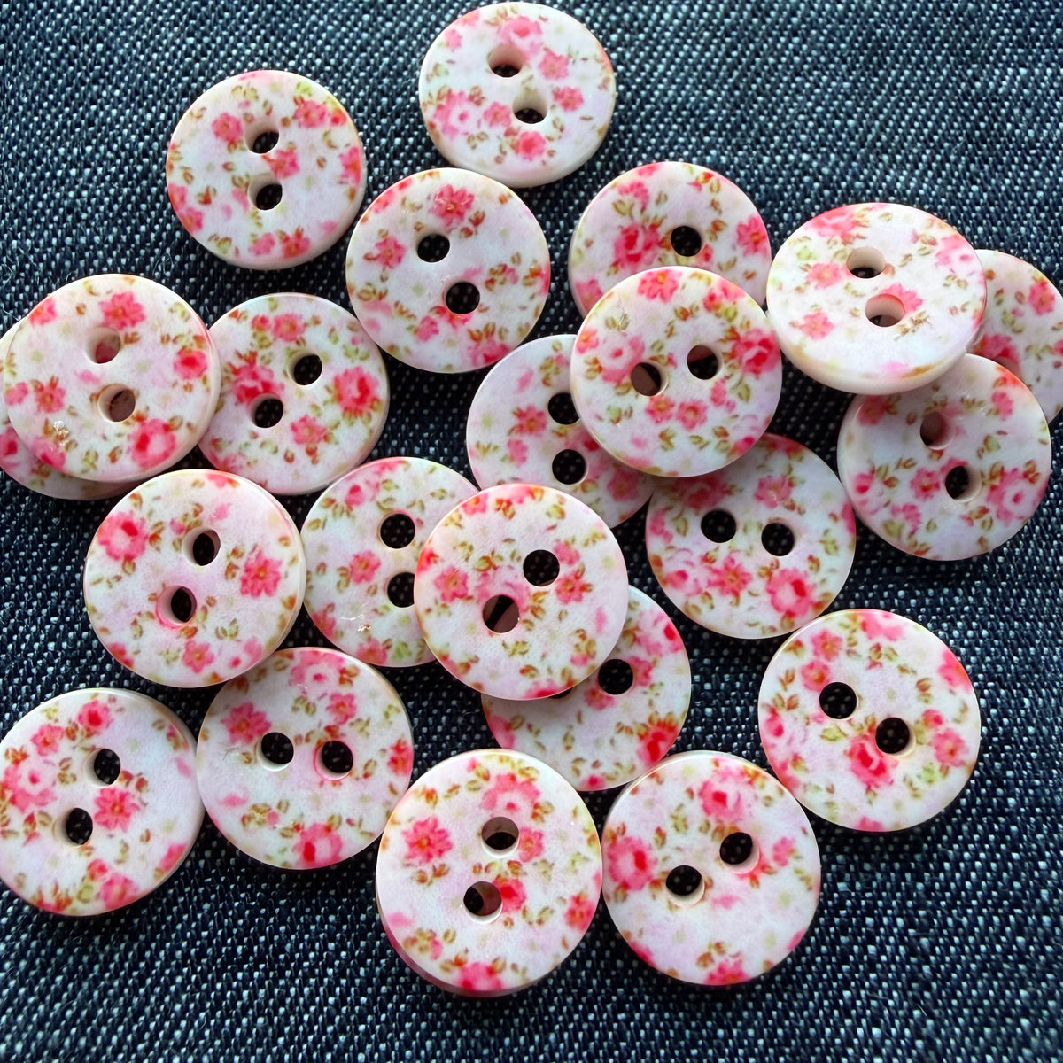 Whimsical patterned plastic shirt buttons in six prints on denim