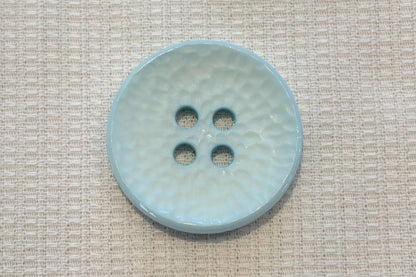 Bouton texturé concave (13 couleurs)