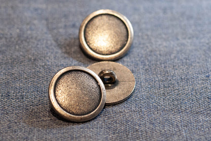Bouton-tige métallique pour vestes, pantalons
